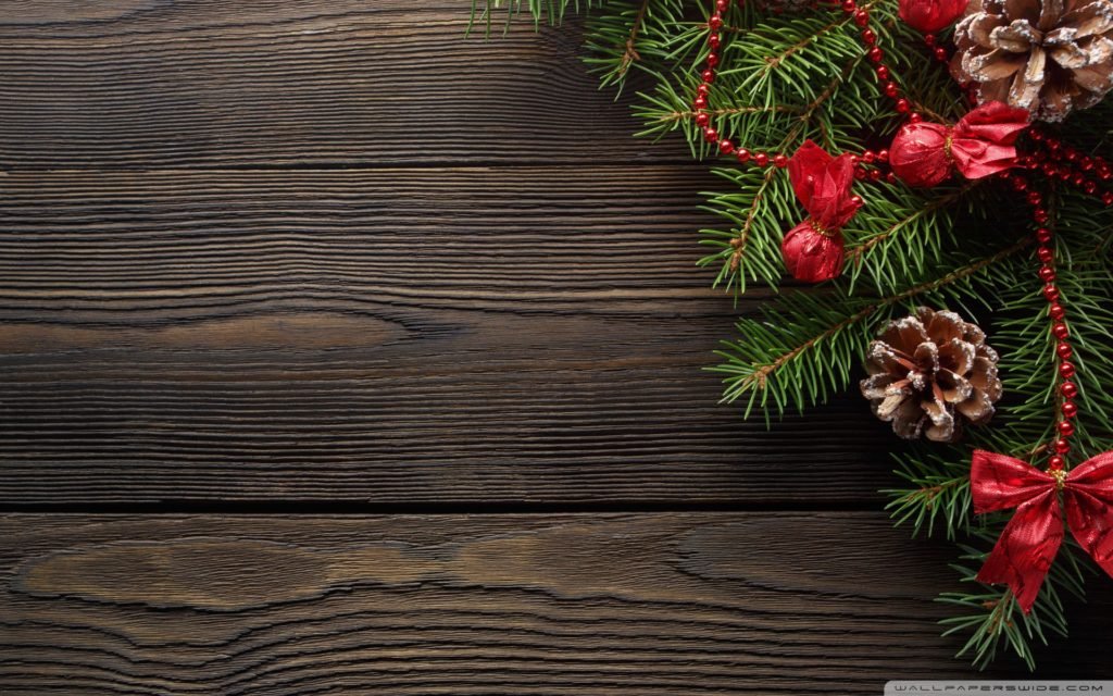 dark_wood_table_with_pine_branch_and_a_pine_conewallpaper1920x1200
